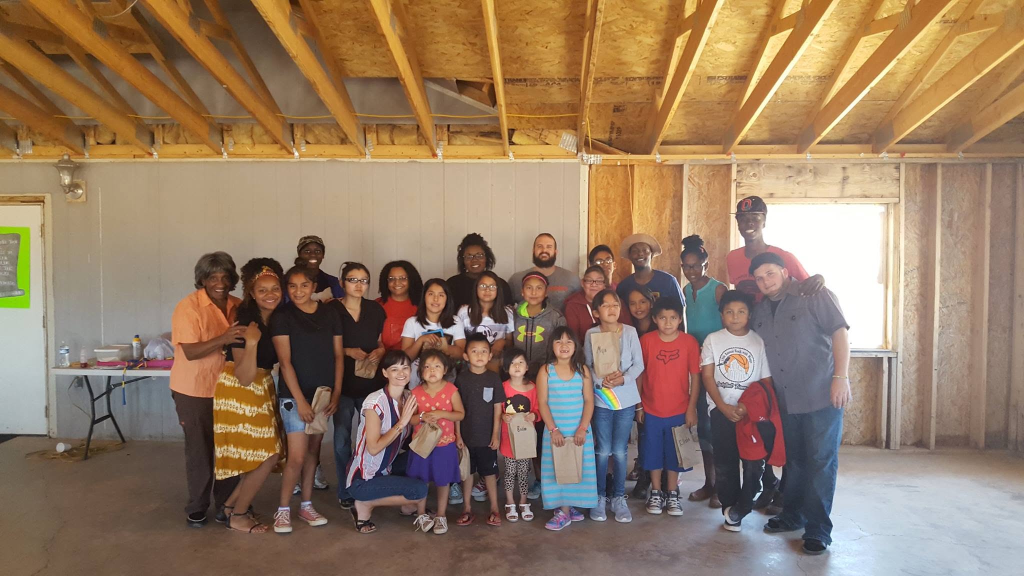 Oasis team gathered with children and families in the Navajo Diné Nation