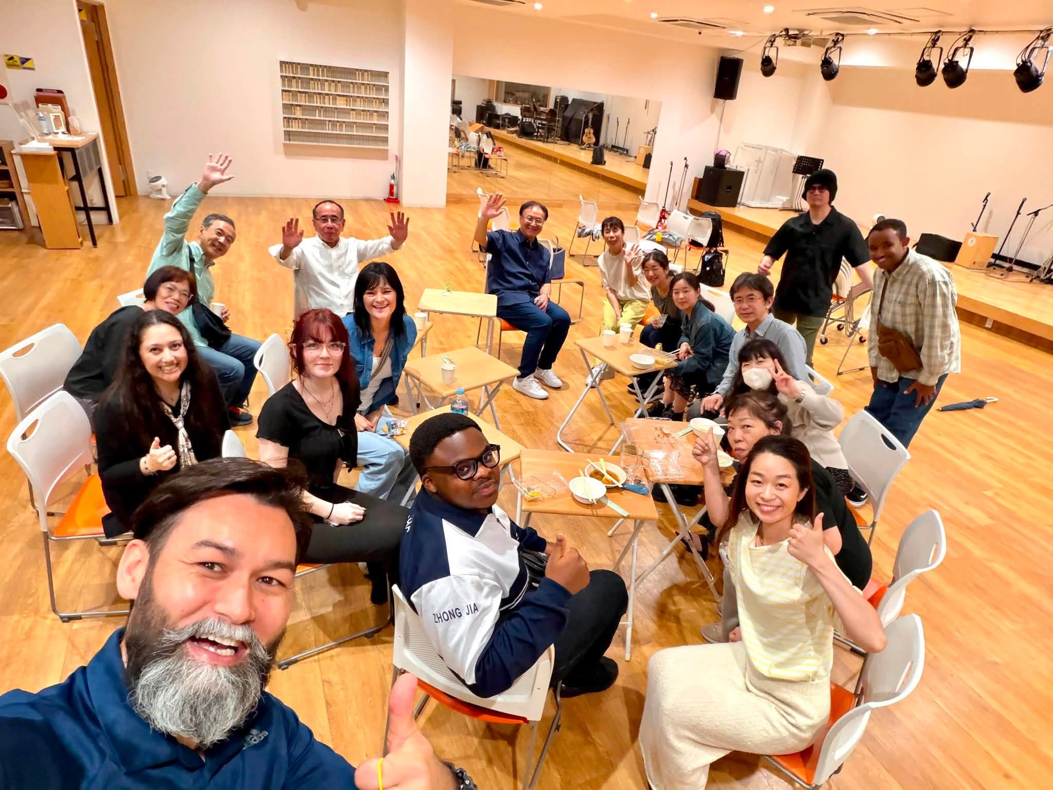 Oasis team and ministry partners gathered indoors in Tokyo, Japan